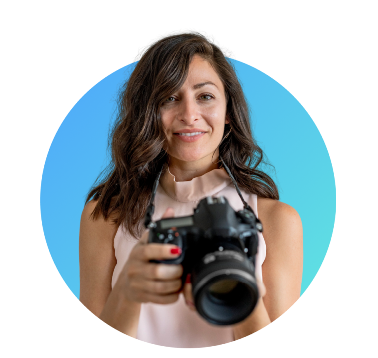 Female photographer holding camera, showcasing volume photography software