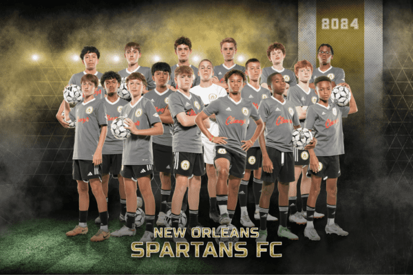 A youth soccer team poses together