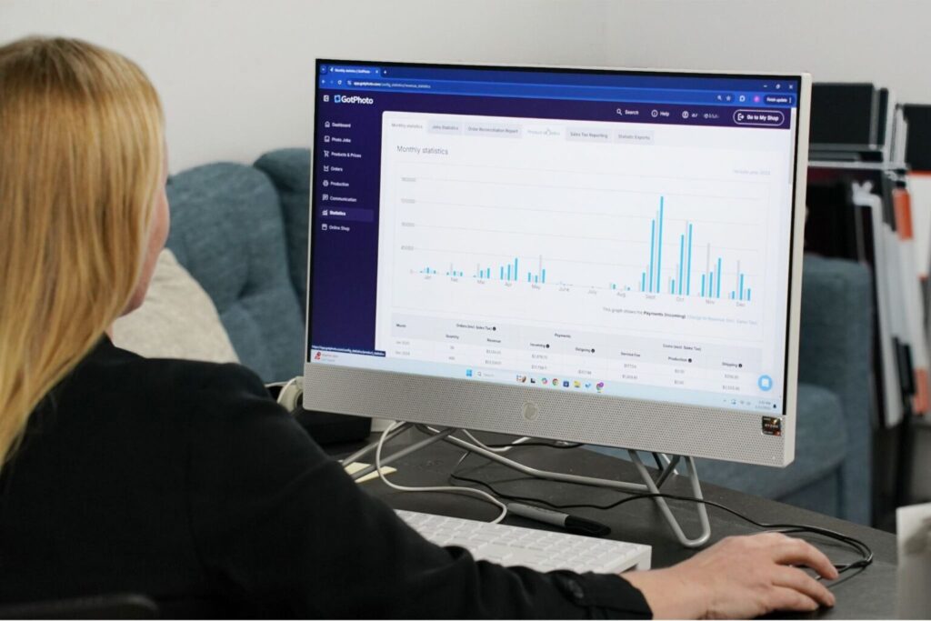 A photographer looks at her monthly statistics on the GotPhoto dashboard
