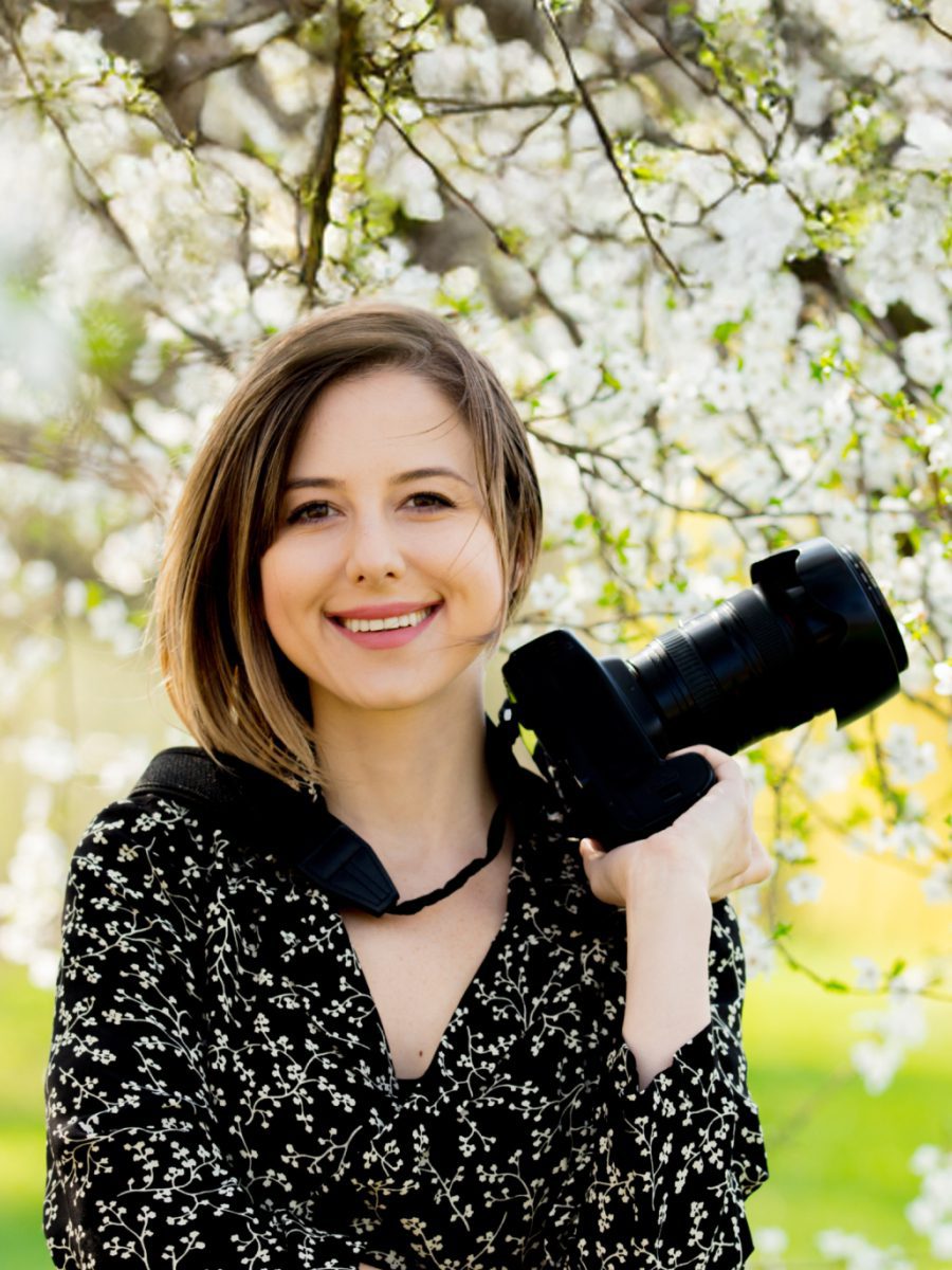 Photographer holding a camera, preparing for a volume photography job.
