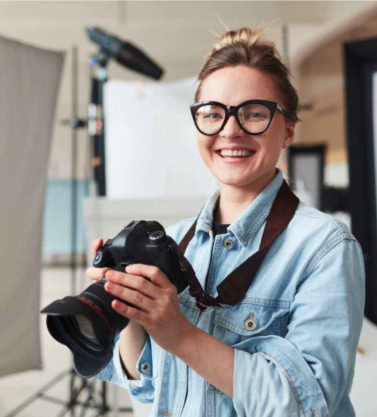 smiling photographer in studio