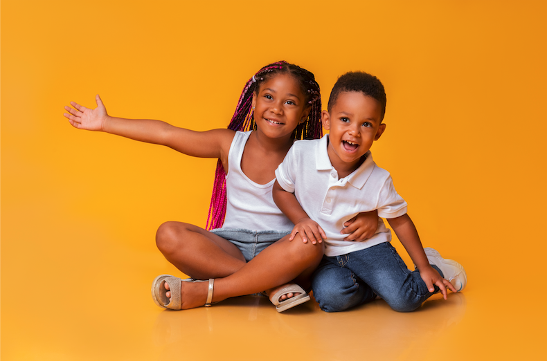 siblings posing for the camera