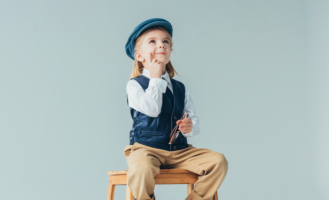 kid sitting on a stool