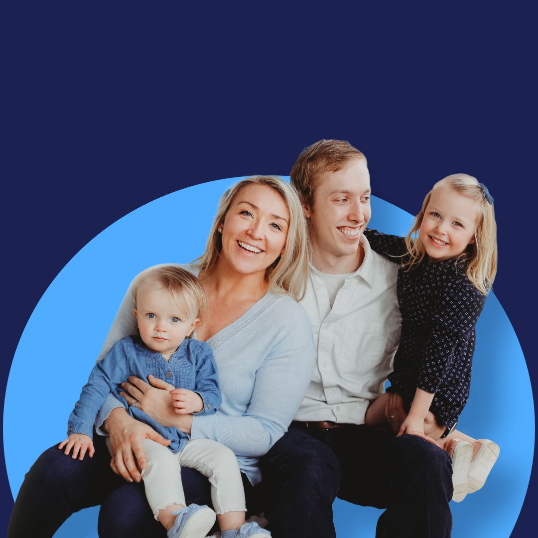 A joyful family of four poses together, exemplifying mini session photography